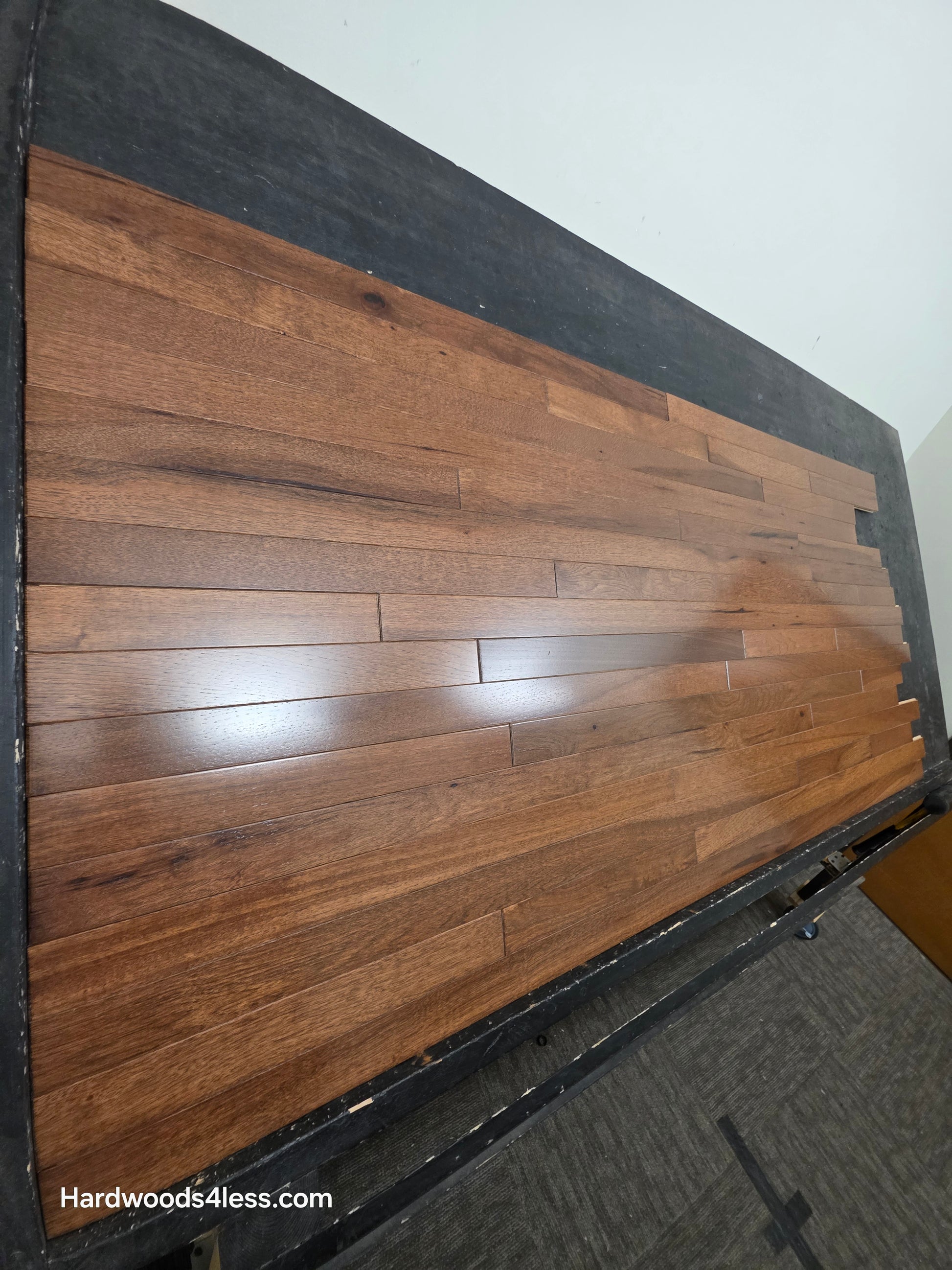 2 1/4" x 3/4" Hickory Nubuck Hardwood Flooring shown on a black shooting table. Shot from the left hand side. 