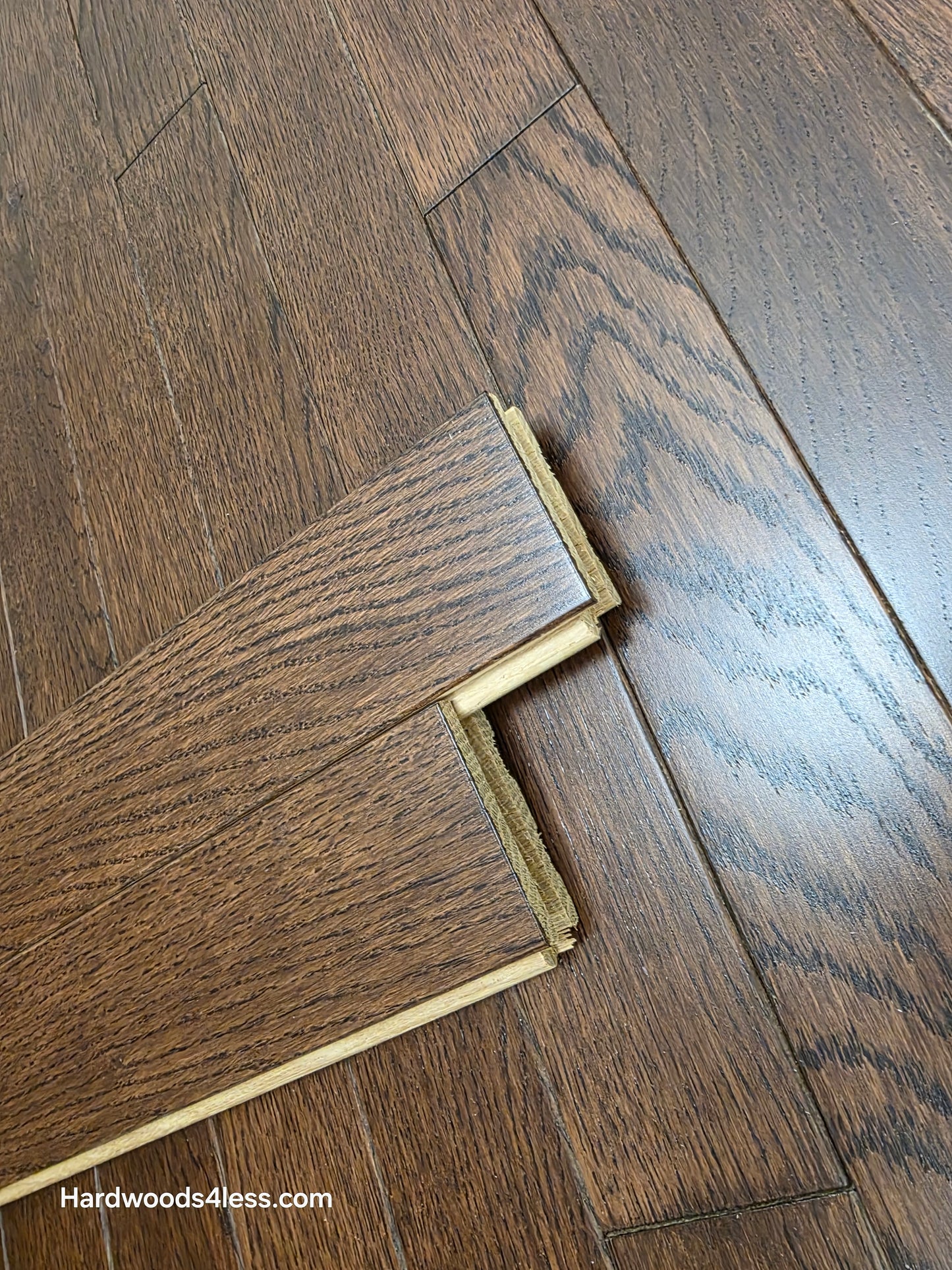 2 1/4" x 3/4" Solid Oak Modica Hardwood Flooring. Shown very close up. two boards stacked on top of each other. 