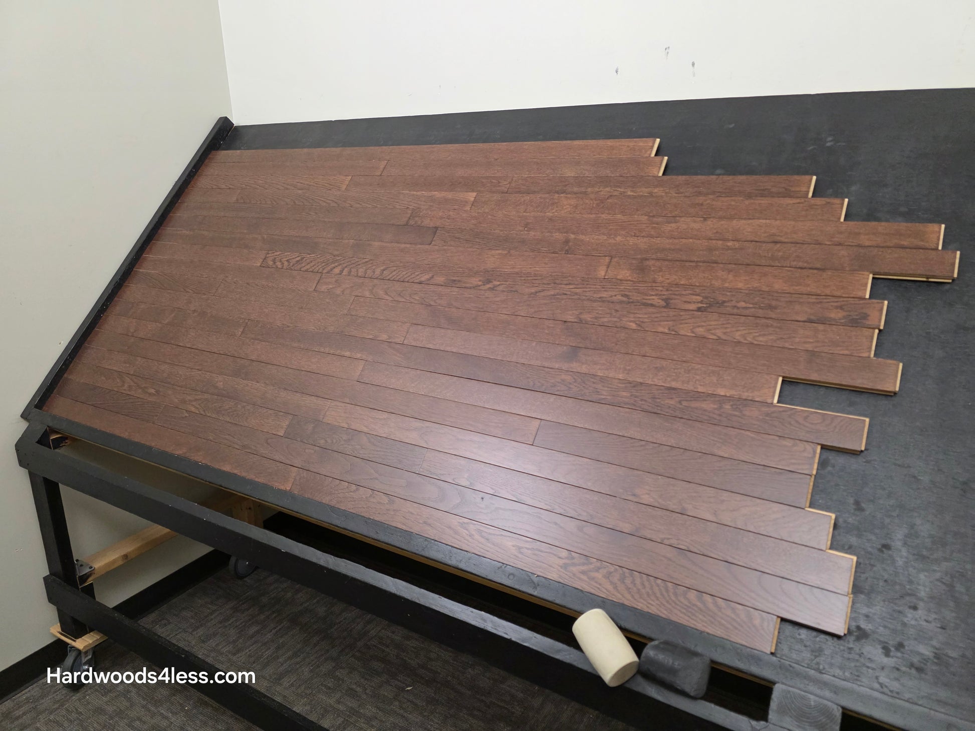 2 1/4" x 3/4" Solid Oak Modica Hardwood Flooring. Shown on a black shooting table. Shot from wide right. 