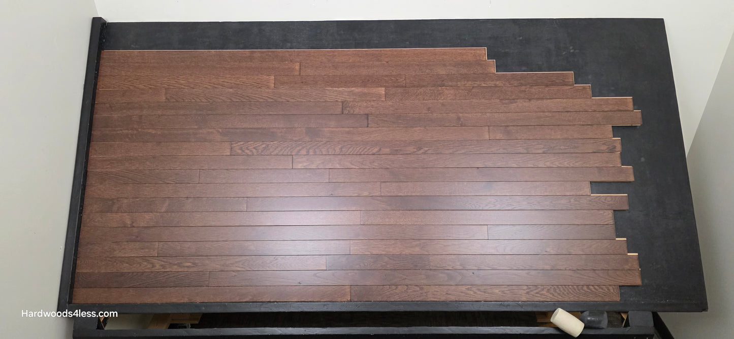 2 1/4" x 3/4" Solid Oak Modica Hardwood Flooring. Shown on a black shooting table. Shot from center. 