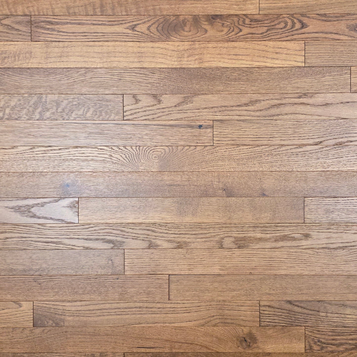 2 1/4" x 3/4" White Oak Gunstock Hardwood Flooring. Shown close up.