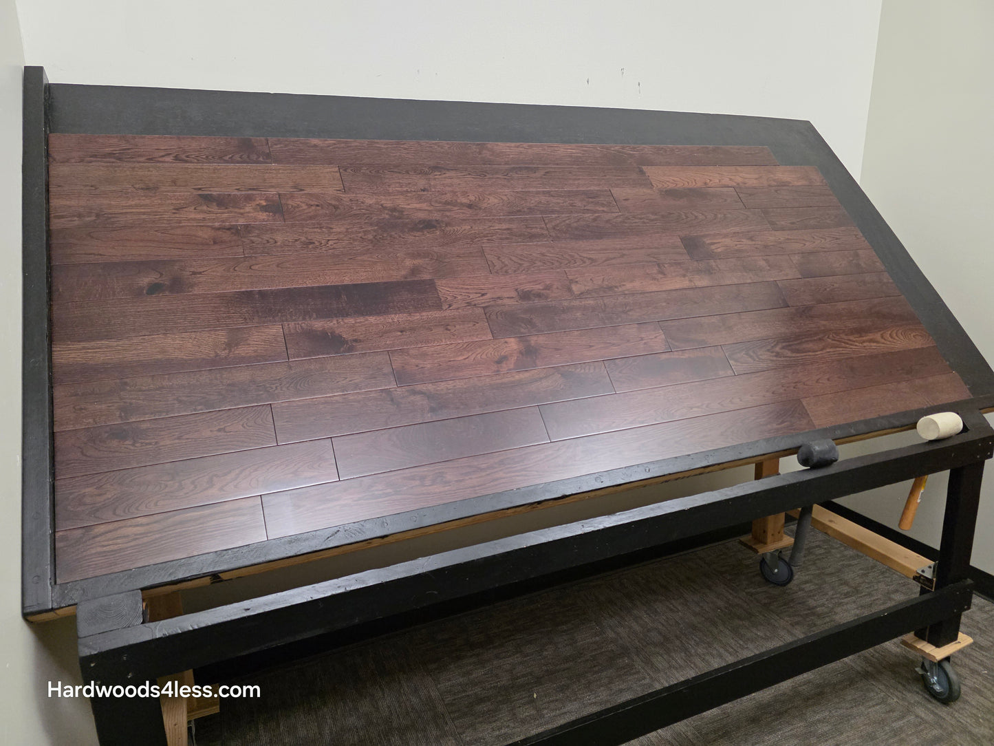 3 1/2" x 3/4" Solid White Oak Ristretto Hardwood Flooring. Shown on a black shooting table. Shot from wide left.