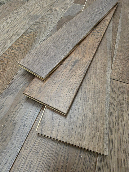 3 1/4", 4", 5" Mixed Width Engineered Hickory Windlass Hardwood Flooring. Three stacked atop each other. 