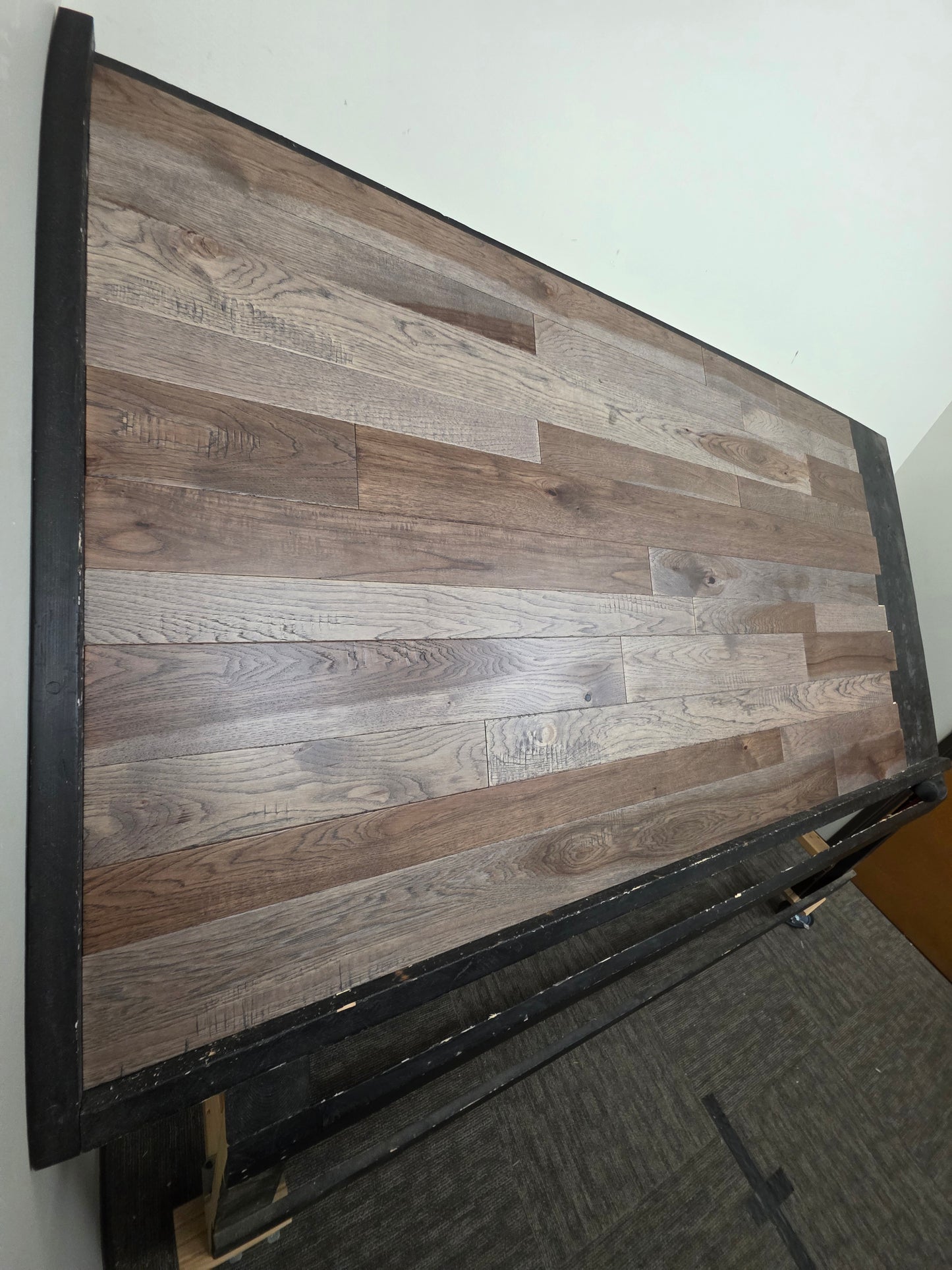 3 1/4", 4", 5" Mixed Width Engineered Hickory Windlass Hardwood Flooring. Shown on a Black shooting table. Left side shot. 