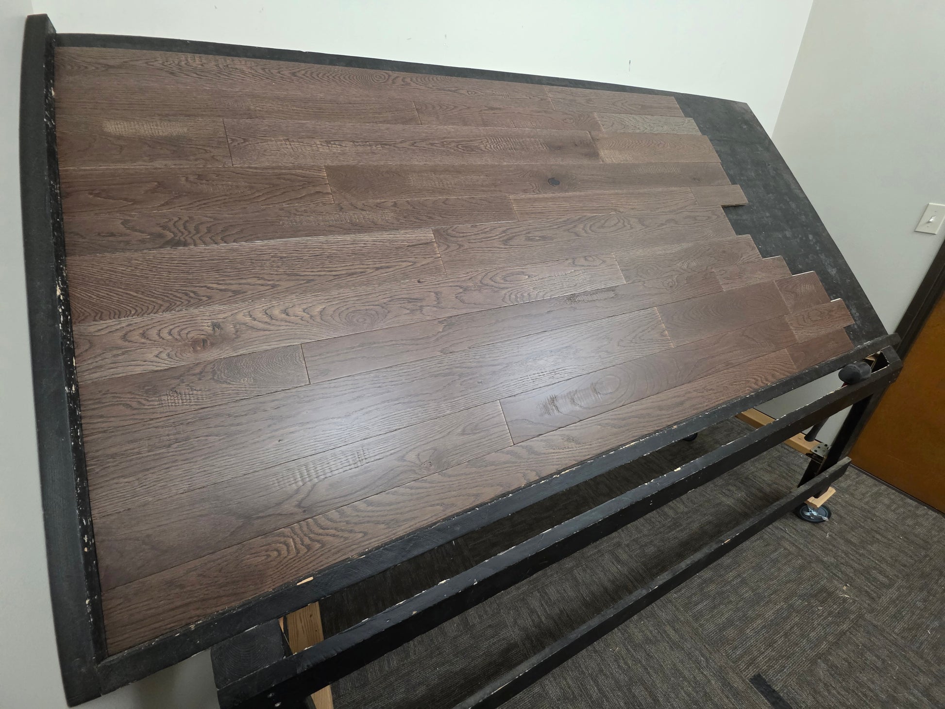 3 1/4", 4", 5" Mixed Width Engineered White Oak Transom Hardwood Flooring. Shown on a black shooting table. Left side shot. 