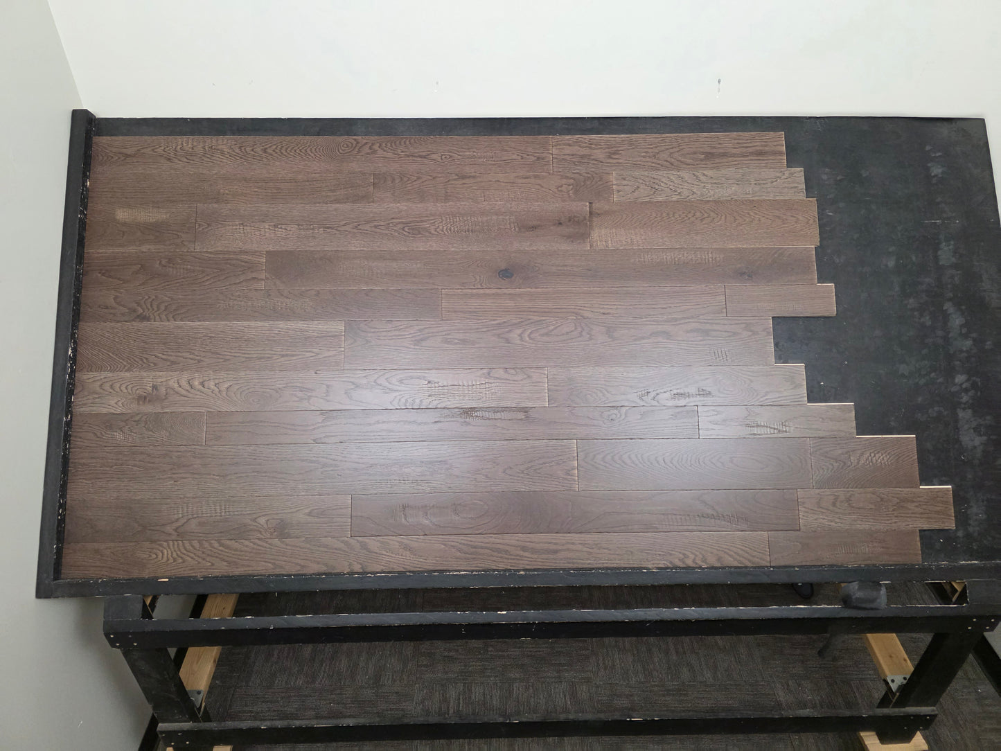 3 1/4", 4", 5" Mixed Width Engineered White Oak Transom Hardwood Flooring. Shown on a black shooting table. Center shot. 