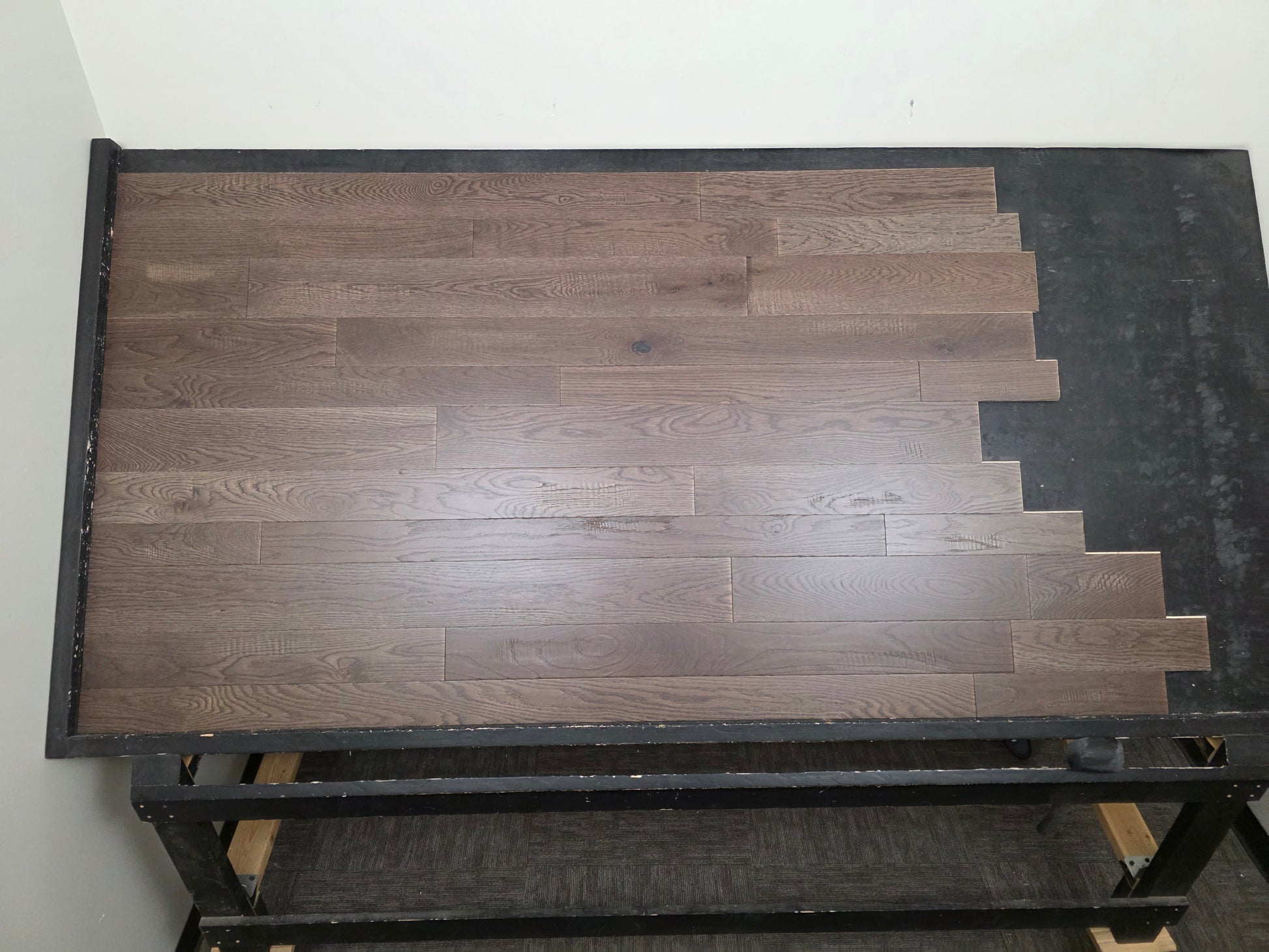 3 1/4", 4", 5" Mixed Width Engineered White Oak Transom Hardwood Flooring. Shown on a black shooting table. Center shot. 