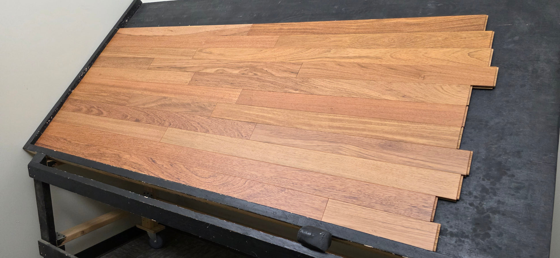 3 1/4" x 3/4" Brazilian Cherry Matte Prefinished Hardwood Flooring. Shown on a black shooting table. Right hand shot.