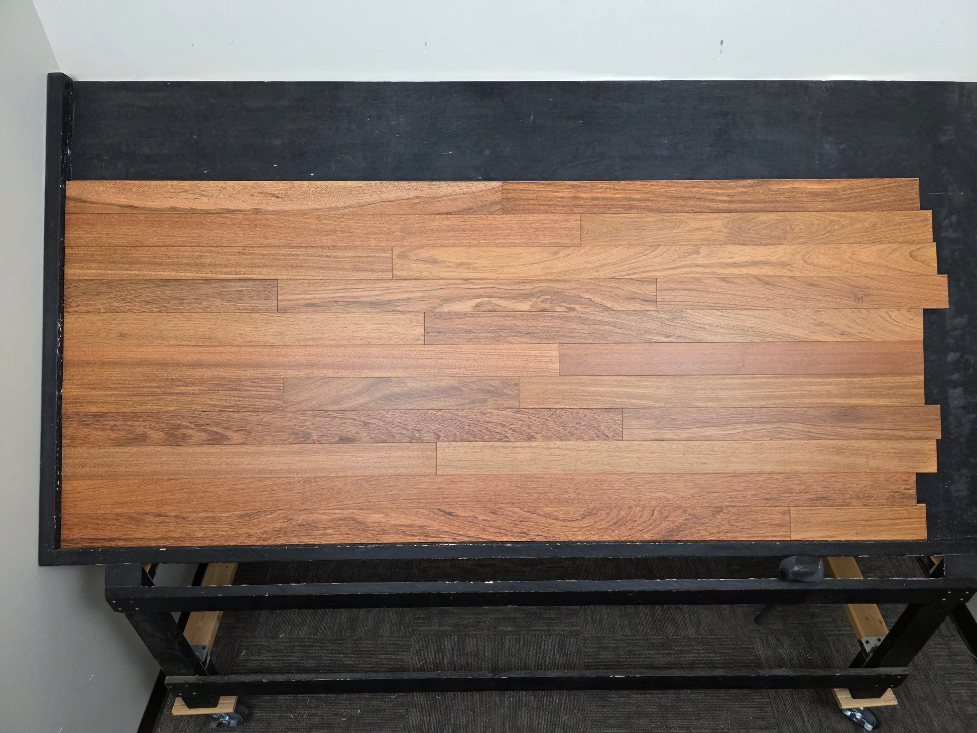 3 1/4" x 3/4" Brazilian Cherry Matte Prefinished Hardwood Flooring. Shown on a black shooting table. Center shot.