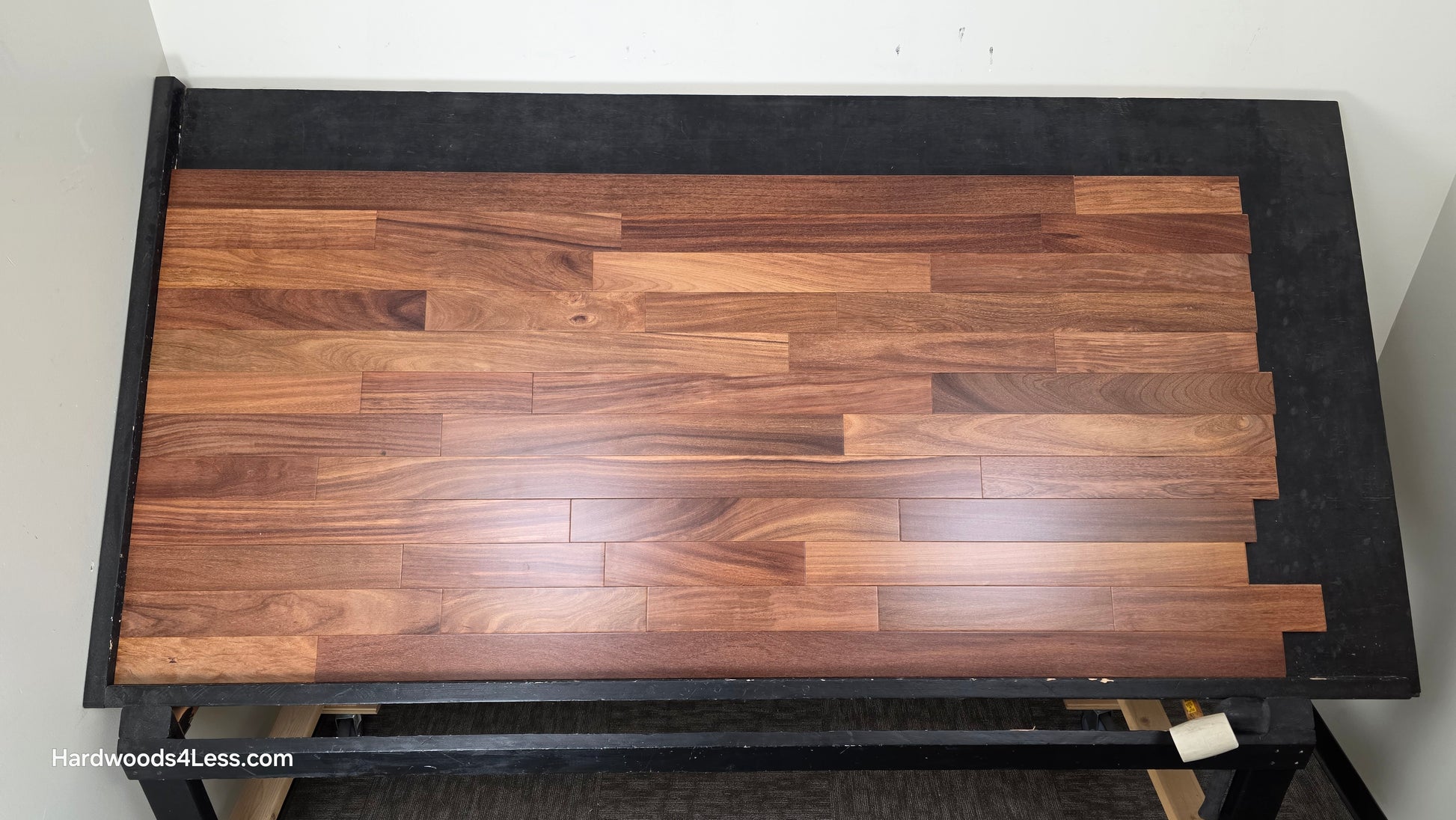 3 1/4" x 3/4" Brazilian Red Teak (Cumaru) Hardwood Flooring. Shown on a black shooting table. Shot from center.
