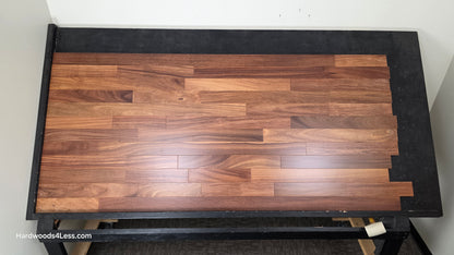 3 1/4" x 3/4" Brazilian Red Teak (Cumaru) Hardwood Flooring. Shown on a black shooting table. Shot from center.