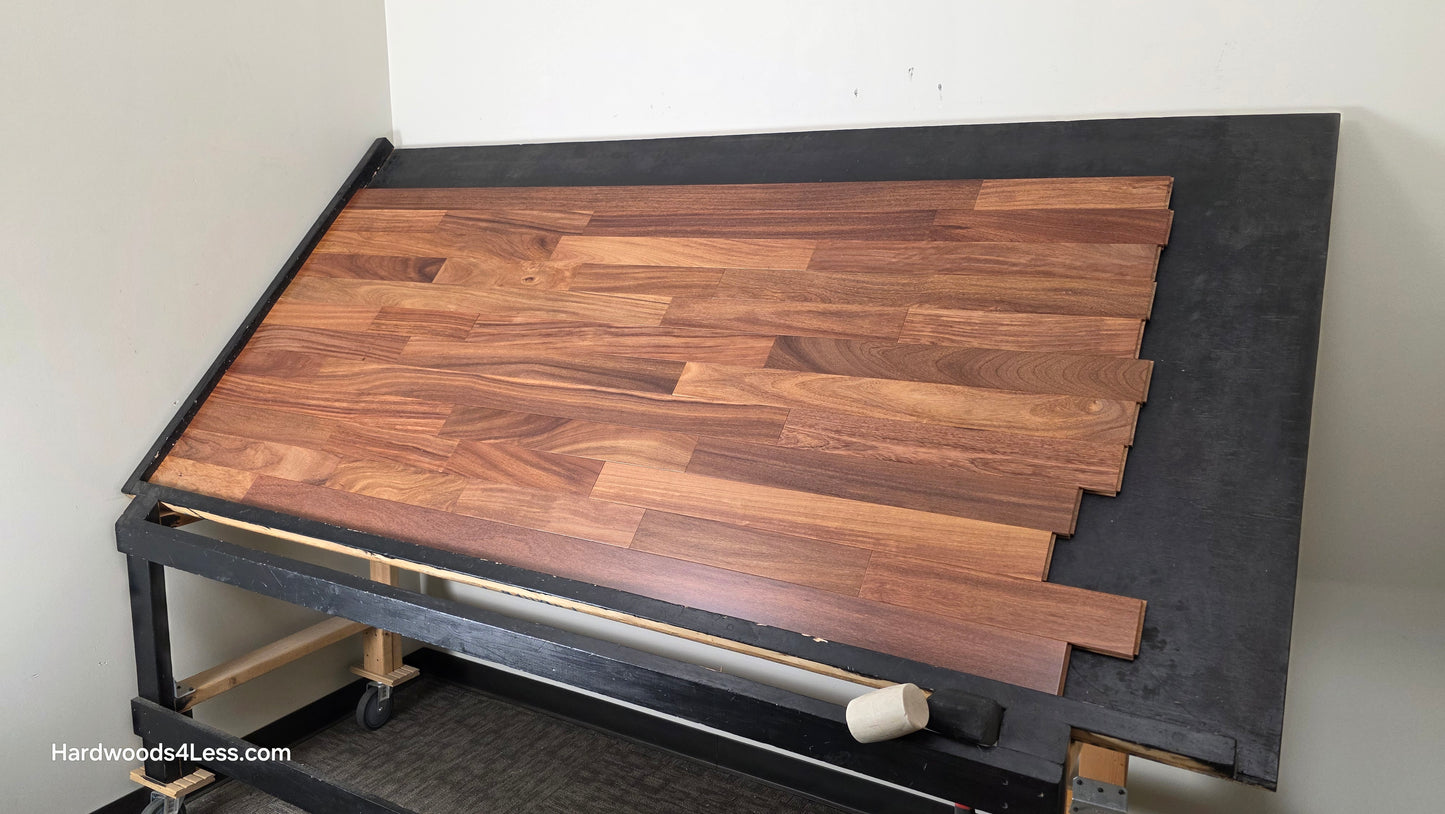 3 1/4" x 3/4" Brazilian Red Teak (Cumaru) Hardwood Flooring. Shown on a black shooting table. Shot from wide right.