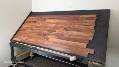 3 1/4" x 3/4" Brazilian Red Teak (Cumaru) Hardwood Flooring. Shown on a black shooting table. Shot from wide right.