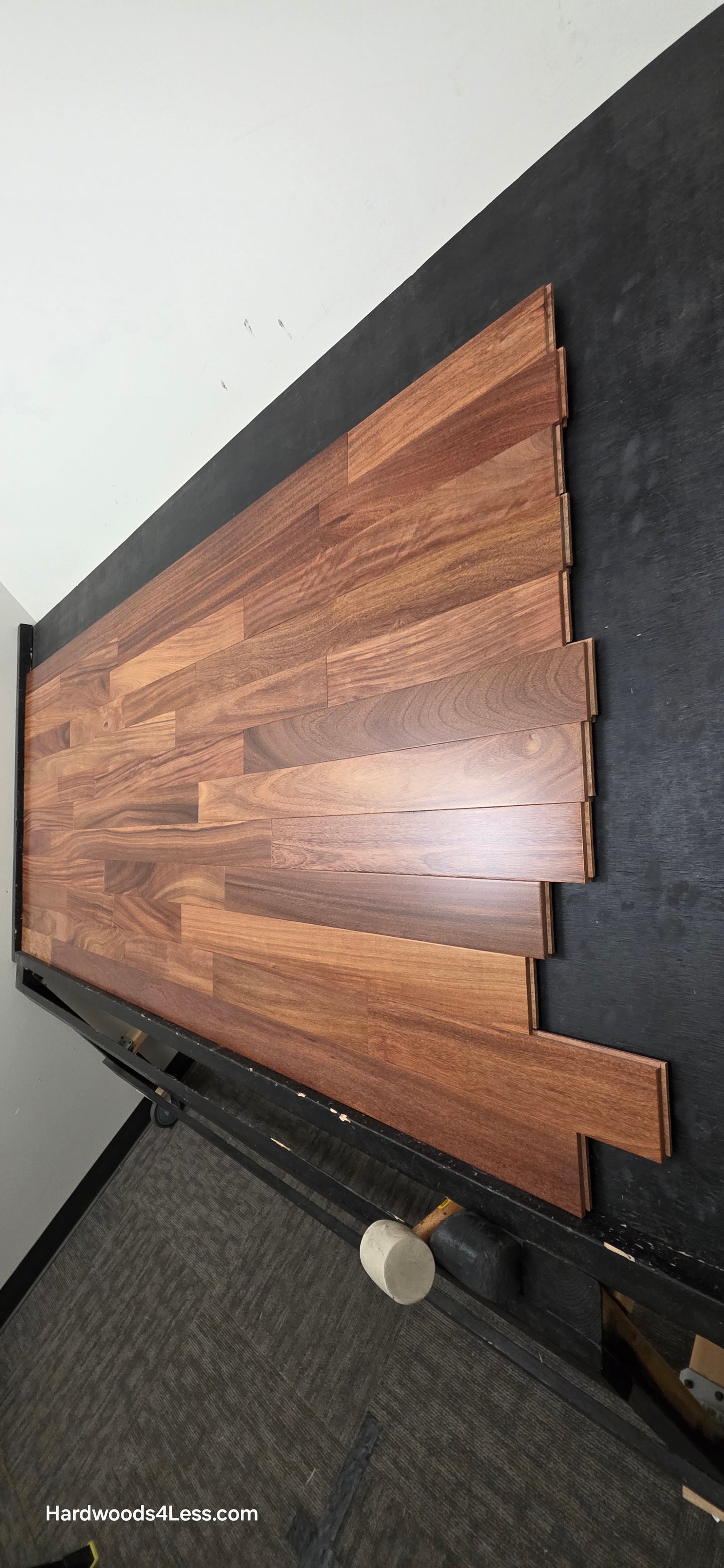 3 1/4" x 3/4" Brazilian Red Teak (Cumaru) Hardwood Flooring. Shown on a black shooting table. Shot from steep right.
