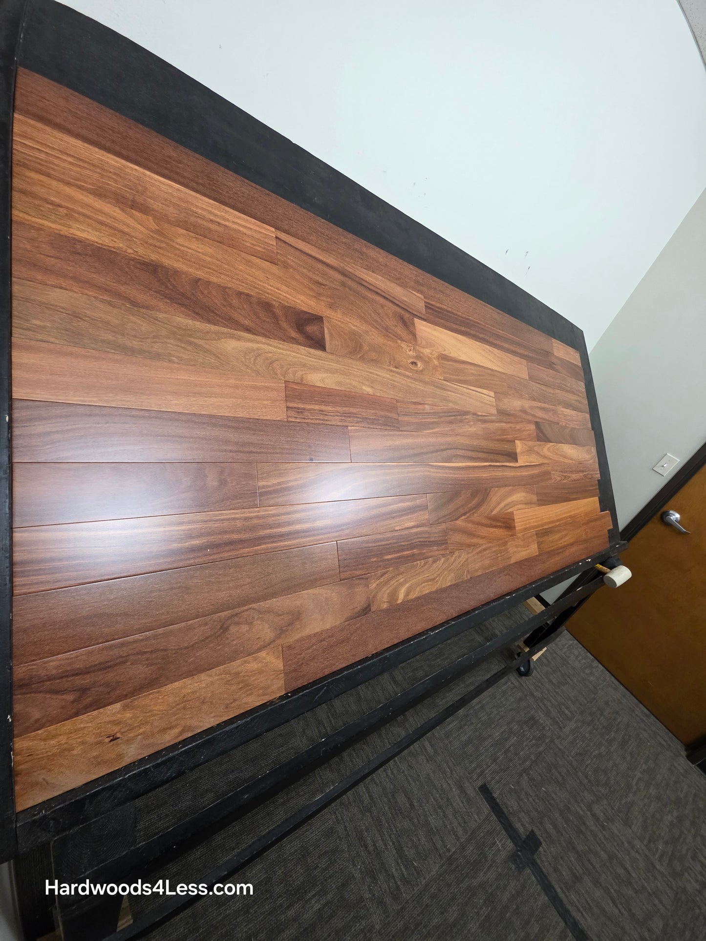 3 1/4" x 3/4" Brazilian Red Teak (Cumaru) Hardwood Flooring. Shown on a black shooting table. Shot from steep left.