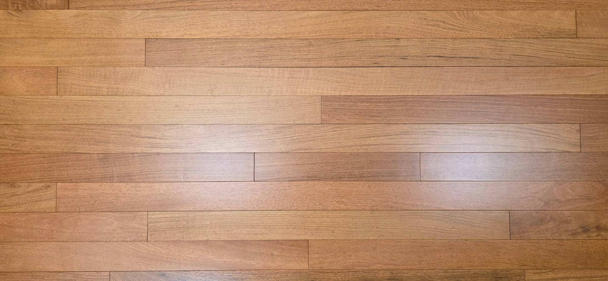 3 1/4" x 3/4" Prefinished Brazilian Cherry Shorts Hardwood Flooring. Show full Aspect ratio, close up.