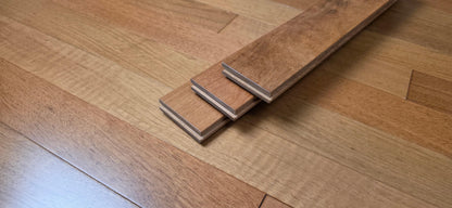 3 1/4" x 3/4" Prefinished Brazilian Cherry Shorts Hardwood Flooring. Shown as 3 planks stacked on top of the Brazilian Cherry flooring.