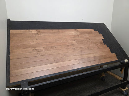 3 1/4" x 3/4" Solid Maple Haystack Hardwood Flooring. Shown on a black shooting table. Shot from wide left.