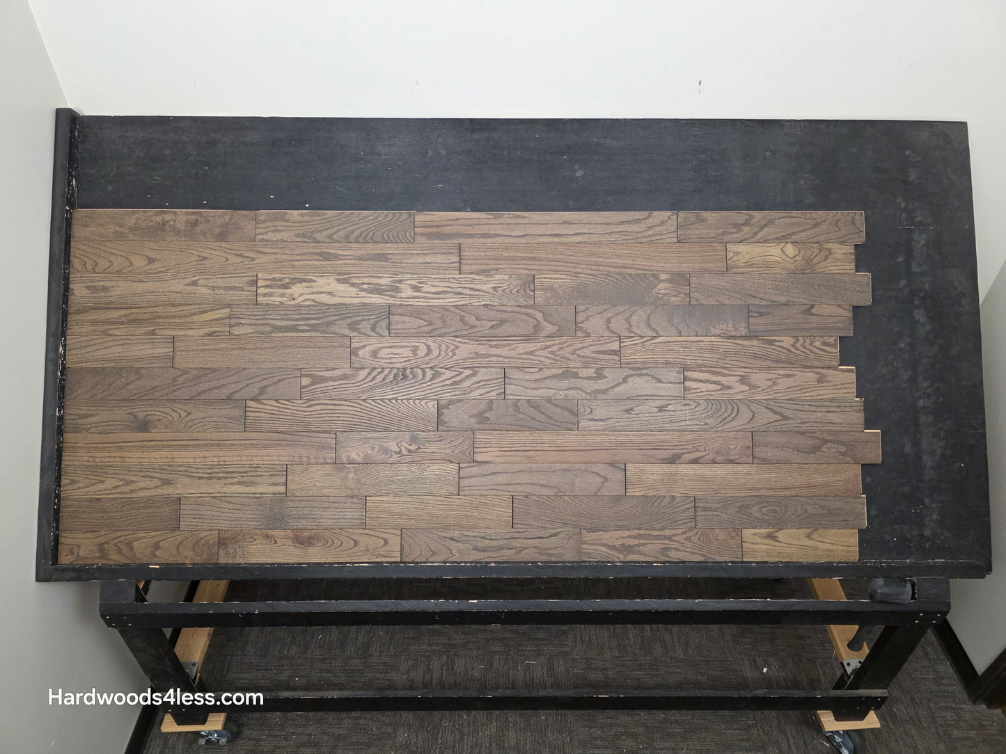 3 1/4" x 3/4" Solid Red Oak Coal Hardwood Flooring. Shown on a black shooting table. Center shot.