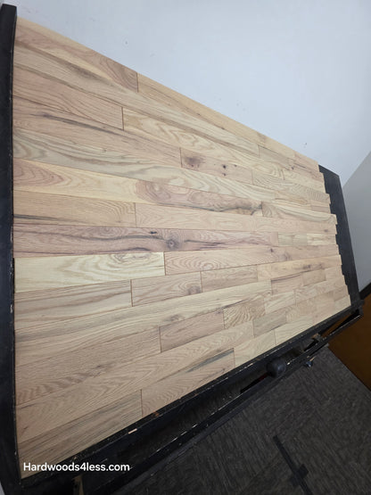 3 1/4" x 3/4" Solid Red Oak Khaki Hardwood Flooring. Shown on a black shooting table. Shot from steep left.