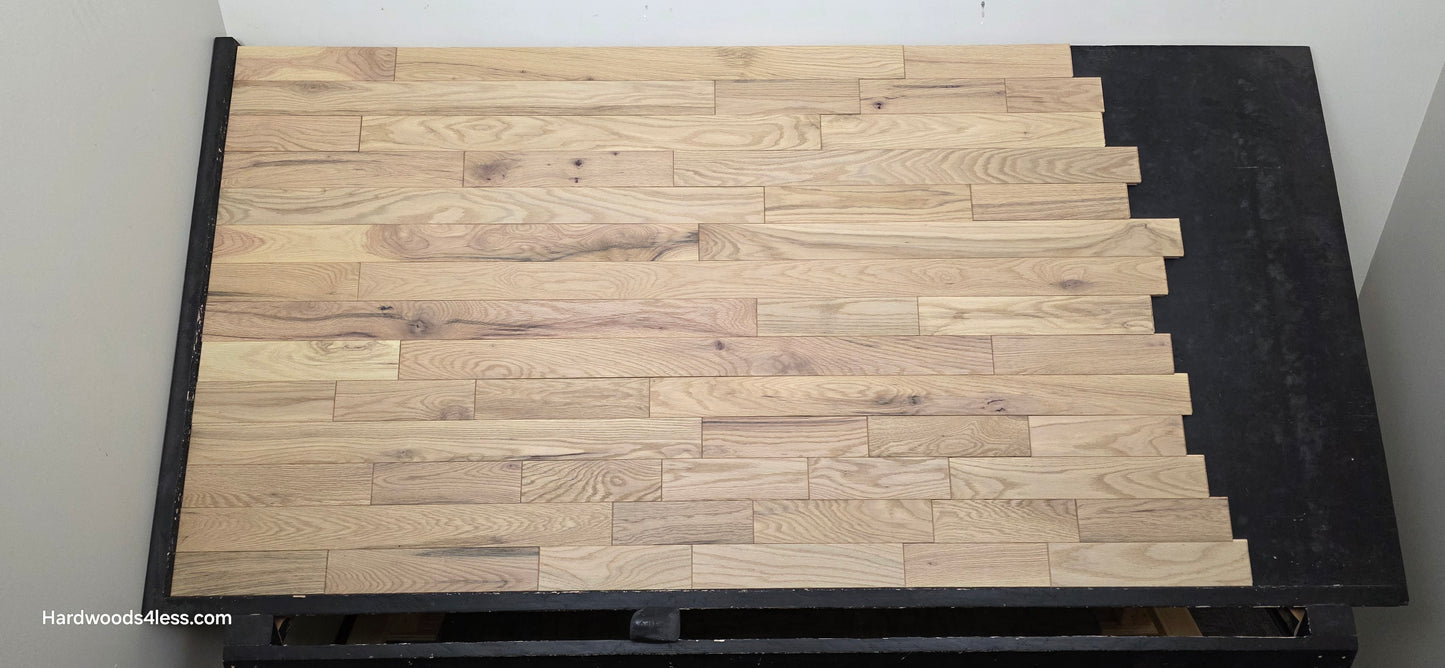 3 1/4" x 3/4" Solid Red Oak Khaki Hardwood Flooring. Shown on a black shooting table. Shot from center.
