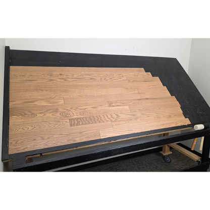 3 1/4" x 3/4" Solid Red Oak Marcy Hardwood Flooring. Shown on a black shooting table. Shot from wide left. 