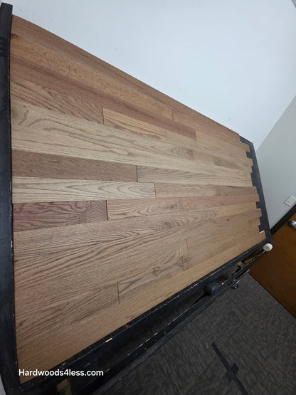 3 1/4" x 3/4" Solid White Oak Rye Hardwood Flooring. Shown on a black shooting table.  Shot from the left hand side. 