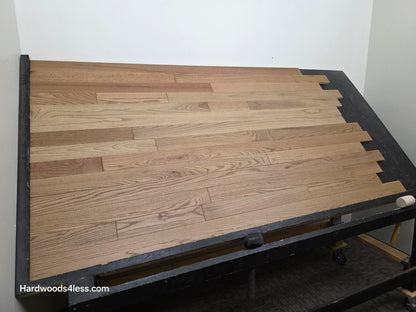 3 1/4" x 3/4" Solid White Oak Rye Hardwood Flooring. Shown on a black shooting table. Wide left shot. 