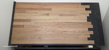3 1/4" x 3/4" Solid White Oak Rye Hardwood Flooring. Shown on a black shooting table. Center shot. 