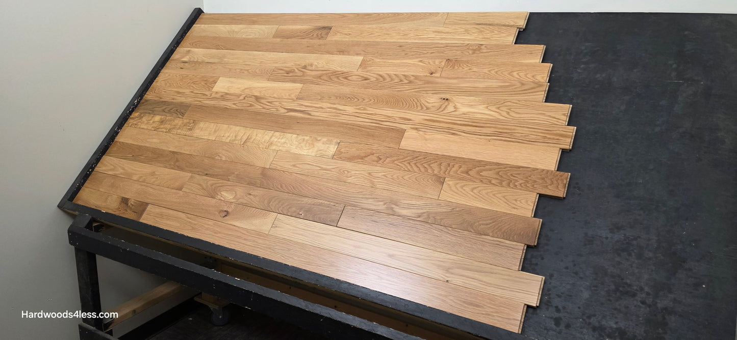 3 1/4" x 3/4" White Oak Natural Hardwood Flooring. Shown on a black shooting table. Right hand shot.
