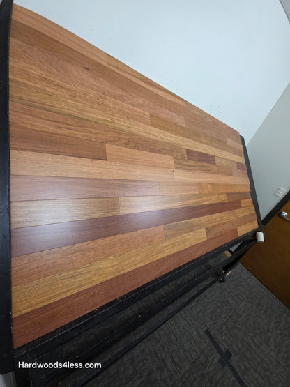 3 1/4" x 3/8" Engineered Brazilian Cherry Hardwood Flooring. Shown on a black shooting table. Shot from tight left. 