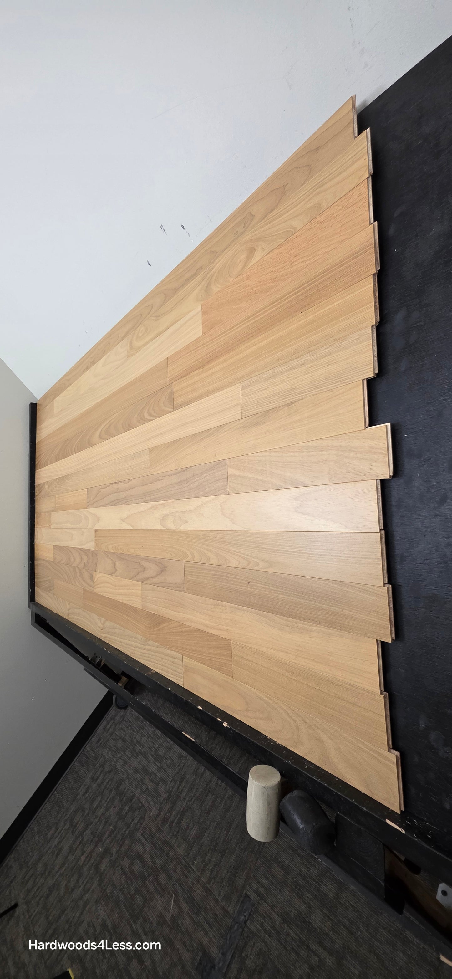 3 1/4" x 3/8" Engineered Brazilian Oak Natural Hardwood Flooring. Shown on a a black shooting table. Shot from steep right.