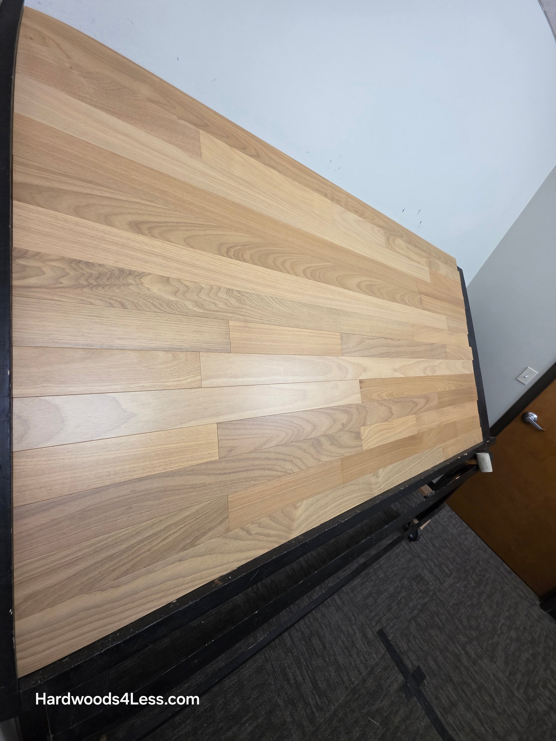 3 1/4" x 3/8" Engineered Brazilian Oak Natural Hardwood Flooring. Shown on a a black shooting table. Shot from Steep left. 