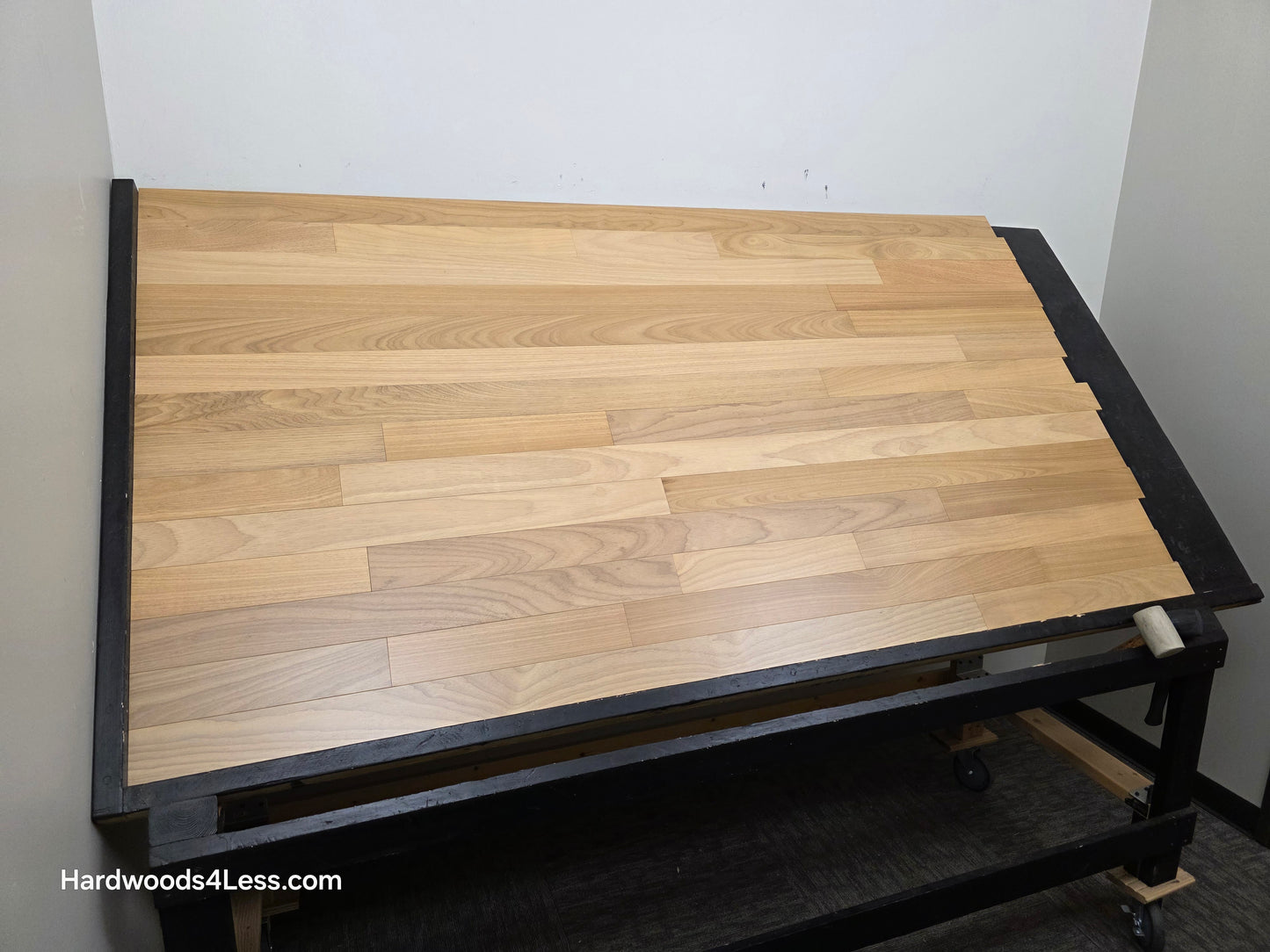 3 1/4" x 3/8" Engineered Brazilian Oak Natural Hardwood Flooring. Shown on a a black shooting table. Shot from wide left. 