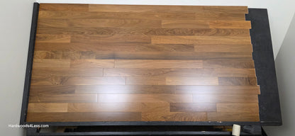 3 1/4" x 3/8" Engineered Brazilian Walnut (IPE) Natural Hardwood Flooring. Shown on a black shooting table. Shot from center.