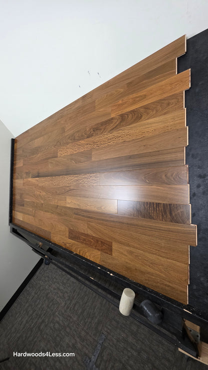 3 1/4" x 3/8" Engineered Brazilian Walnut (IPE) Natural Hardwood Flooring. Shown on a black shooting table. Shot from steep right.