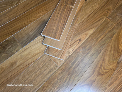 3 1/4" x 3/8" Engineered Brazilian Walnut (IPE) Natural Hardwood Flooring. Shown as three Hardwood flooring planks. Stacked on top of the Brazilian walnut flooring. 