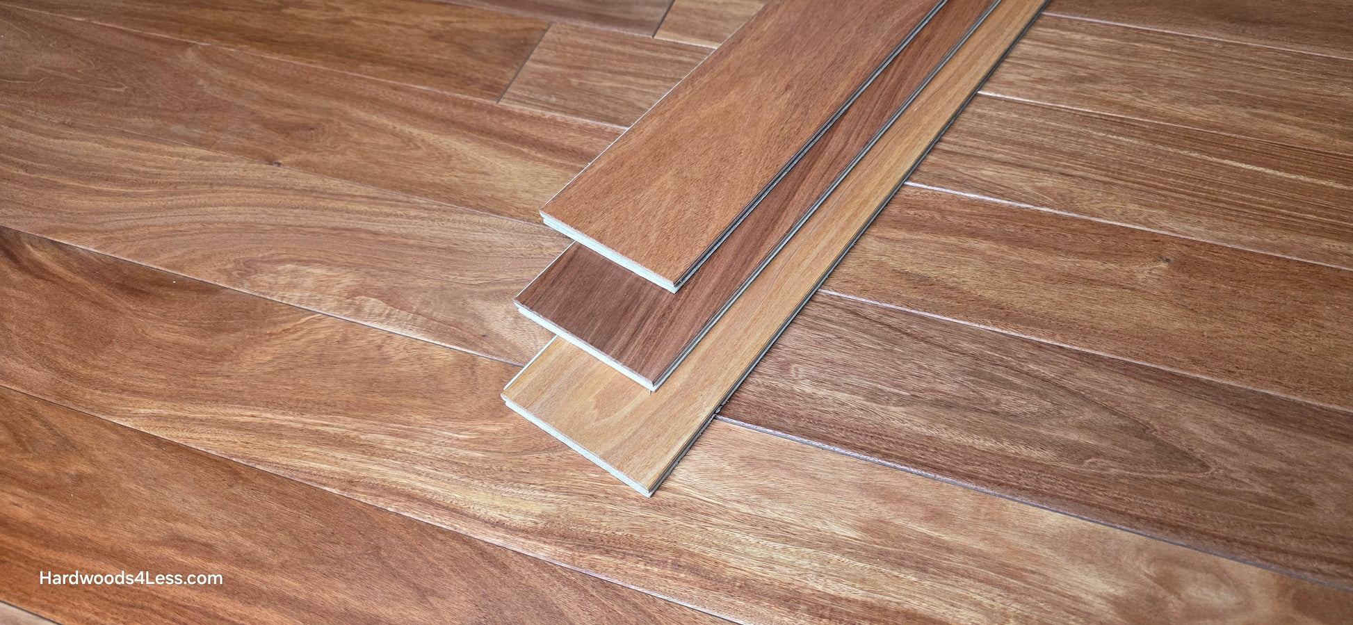 3 1/4" x 3/8" Engineered Santos Mahogany Hardwood Flooring. Shown in the center is three hardwood flooring planks stacked on top of the Santos Mahogany flooring.