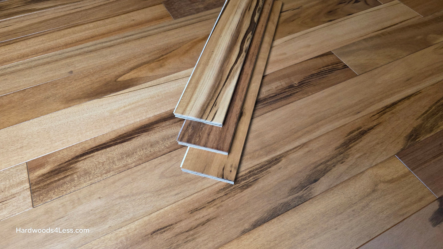 3 1/4" x 3/8" Engineered Tigerwood Hardwood Flooring. Shown as 3 planks stacked on top of the Tigerwood hardwood flooring.