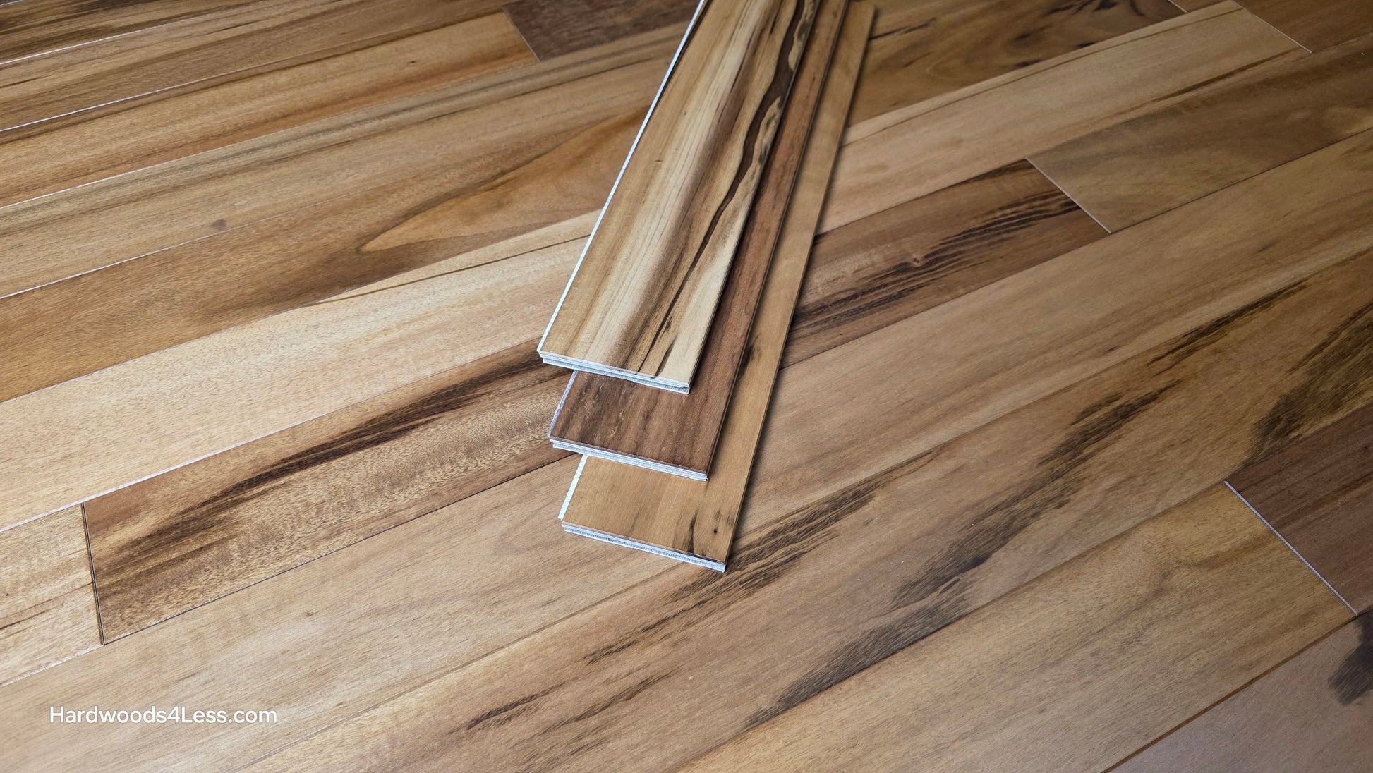 3 1/4" x 3/8" Engineered Tigerwood Hardwood Flooring. Shown as 3 planks stacked on top of the Tigerwood hardwood flooring.