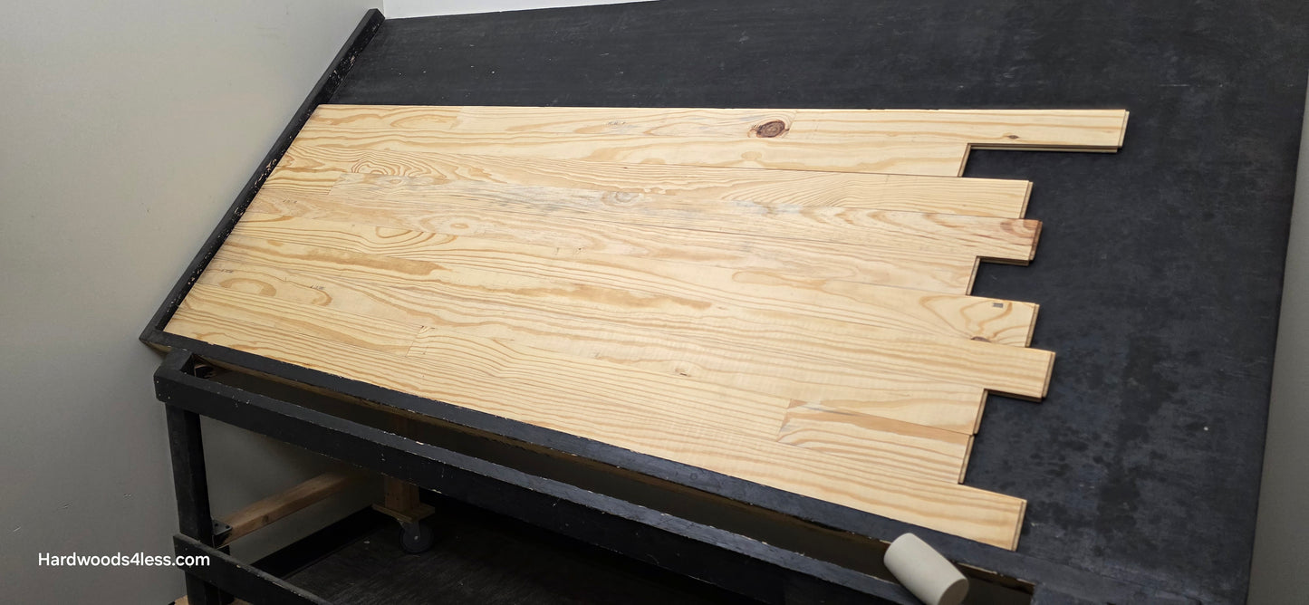 3 1/8" x 3/4" Unfinished Southern Yellow Pine Solid Hardwood Flooring. Shown on a black shooting table shot from the right hand side. 