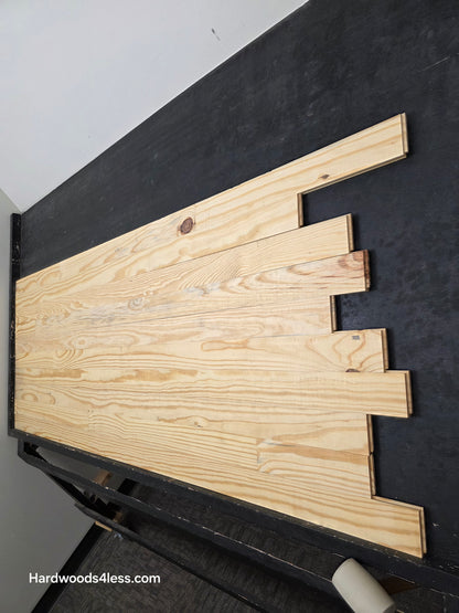 3 1/8" x 3/4" Unfinished Southern Yellow Pine Solid Hardwood Flooring. Shown on a black shooting table shot from the right hand side. 