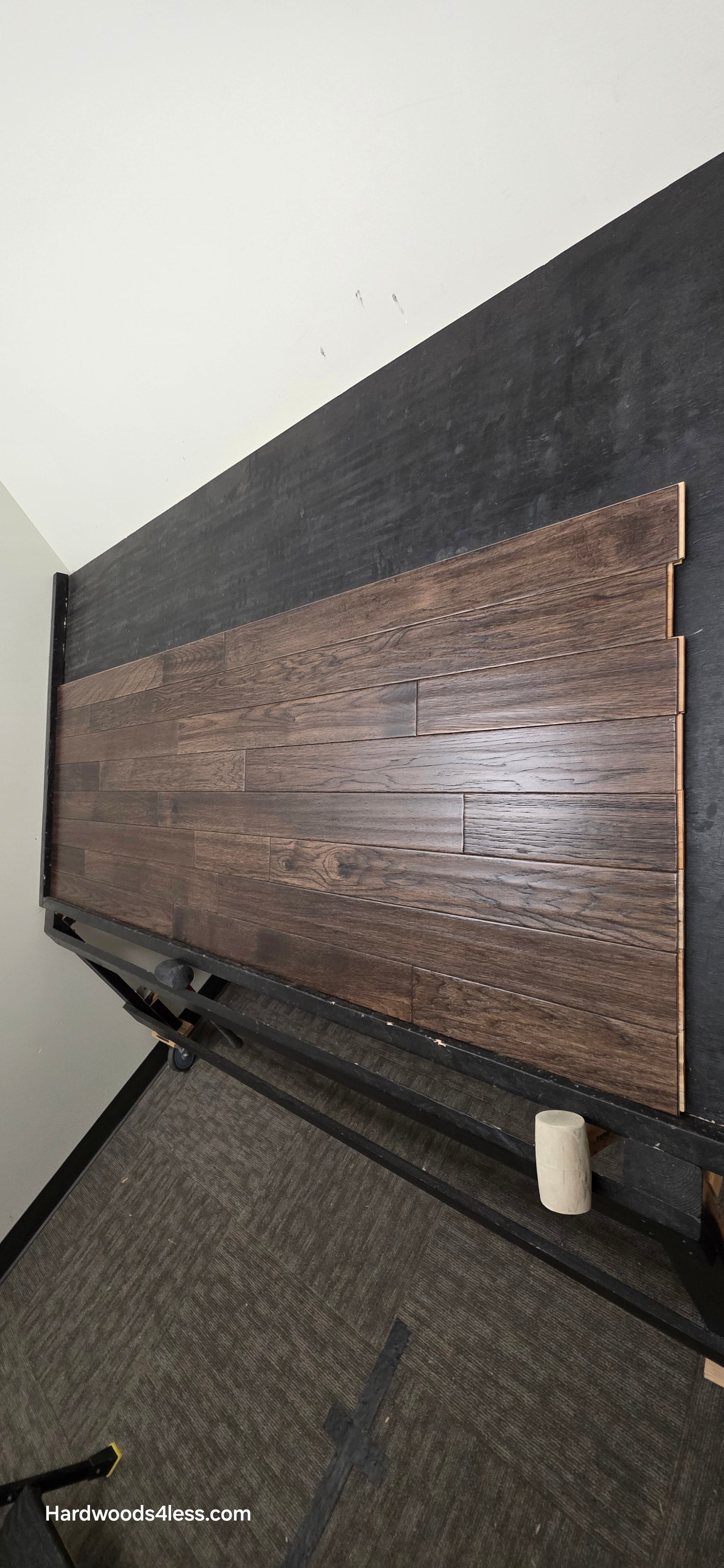 3 3/4" x 3/4" Solid Hickory Prescott Hardwood Flooring. Shown on a black shooting table. Shot from steep right.