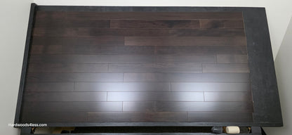 3 5/8" x 3/4" Solid Brazilian Oak Burnt Umber Hardwood Flooring. Shown on a black shooting table. Shot from center.