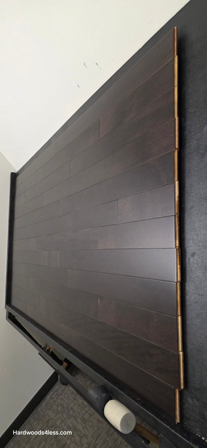 3 5/8" x 3/4" Solid Brazilian Oak Burnt Umber Hardwood Flooring. Shown on a black shooting table. Shot from wide steep right.