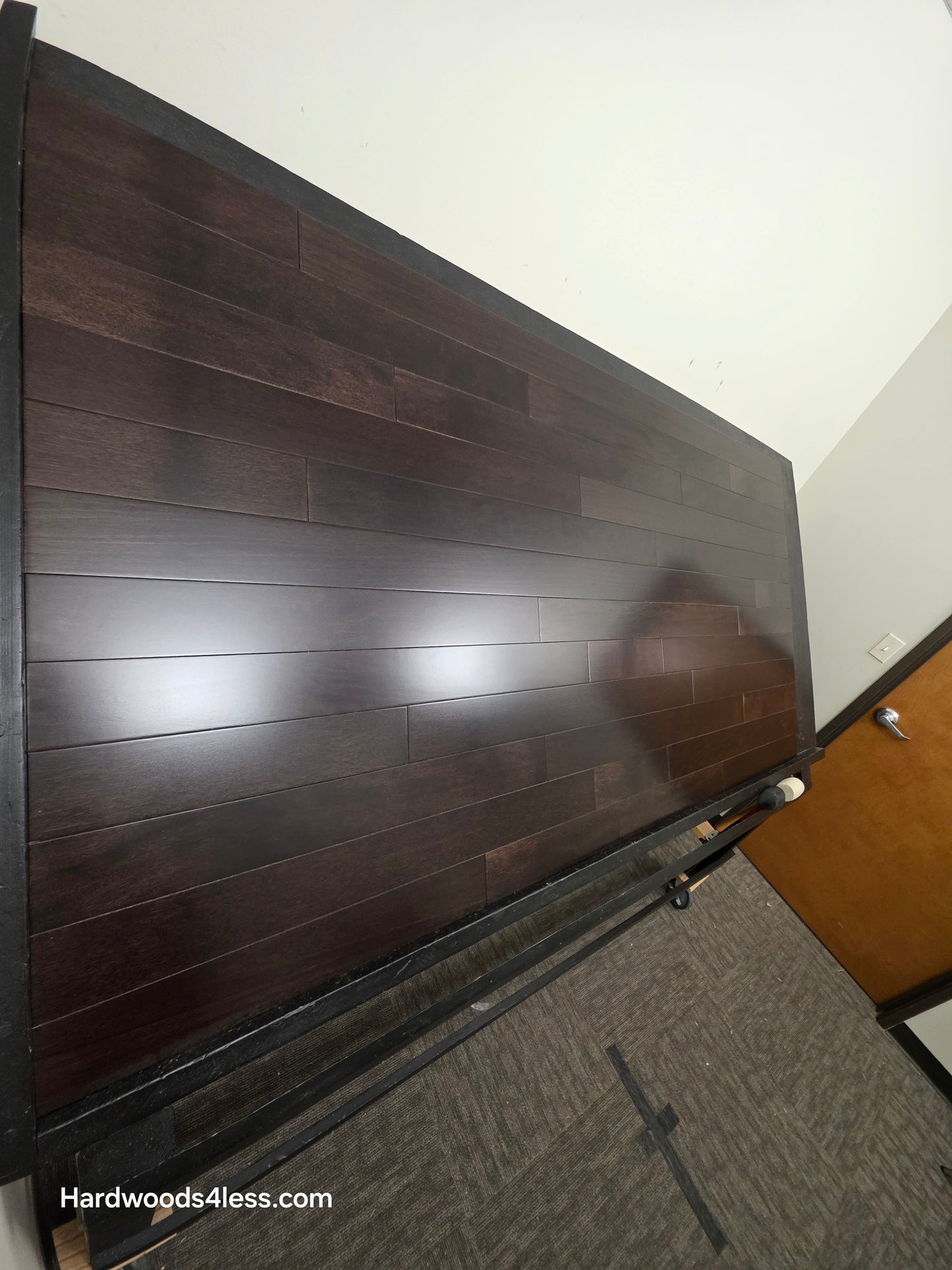 3 5/8" x 3/4" Solid Brazilian Oak Burnt Umber Hardwood Flooring. Shown on a black shooting table. Shot from steep left.