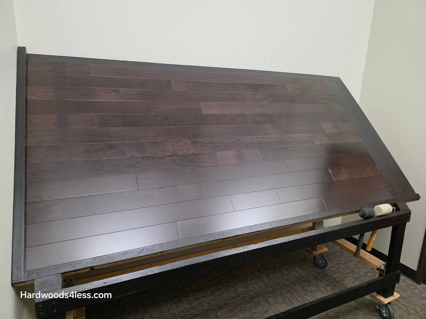 3 5/8" x 3/4" Solid Brazilian Oak Burnt Umber Hardwood Flooring. Shown on a black shooting table. Shot from wide left.