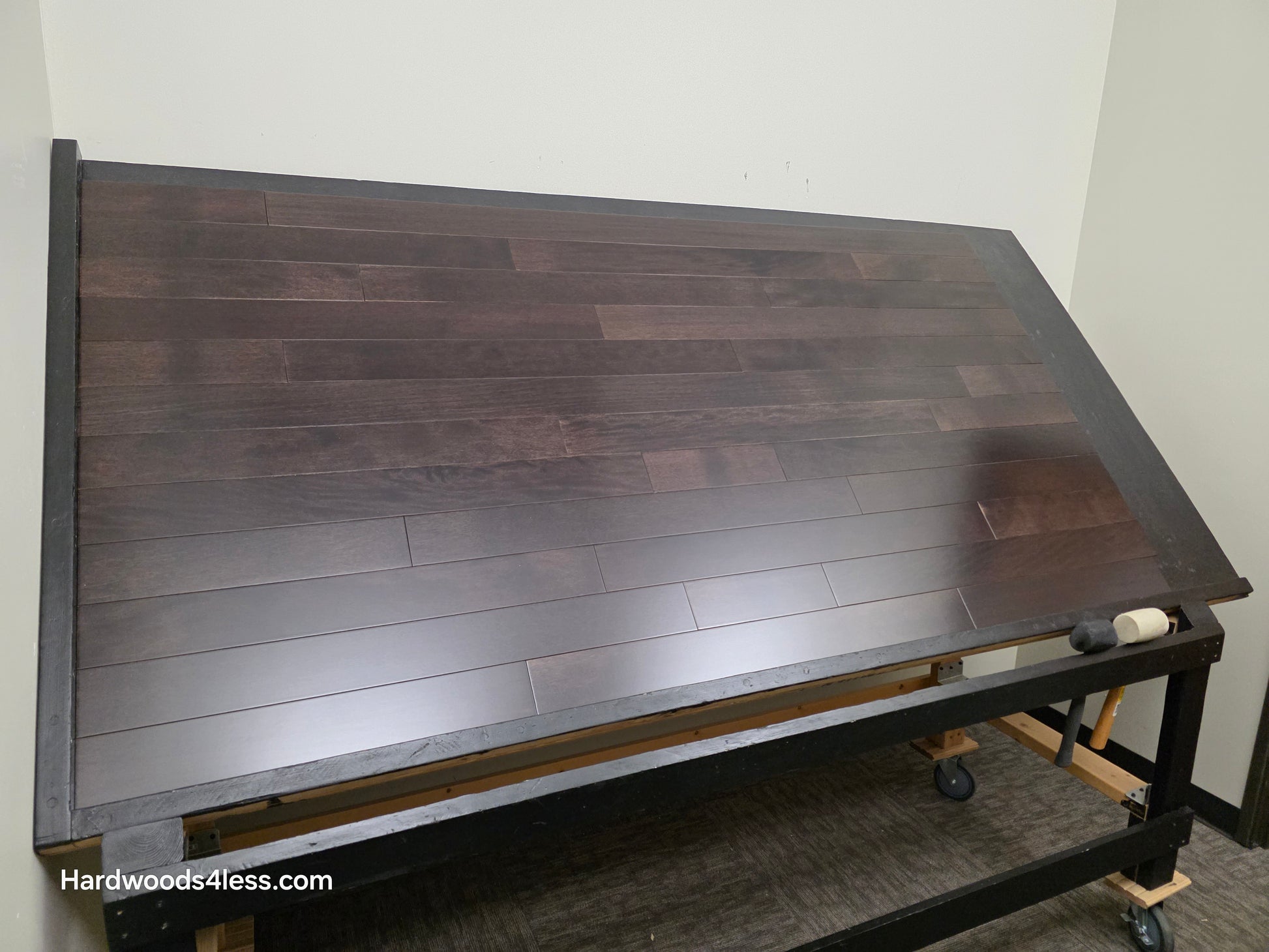 3 5/8" x 3/4" Solid Brazilian Oak Burnt Umber Hardwood Flooring. Shown on a black shooting table. Shot from wide left.