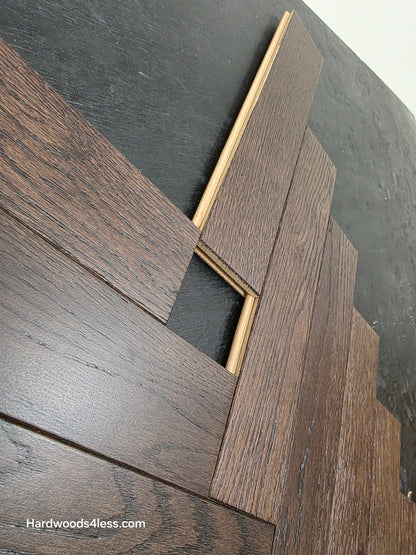 3" x 15" x 3/4" Solid White Oak Salem Herringbone Hardwood Flooring. Shown on a black shooting table. Close up of the Tongue and Groove.