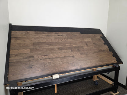 3" x 3/8" Engineered Red Oak Mace Hardwood Flooring. Shown on a black shooting table. Shot from wide left. 